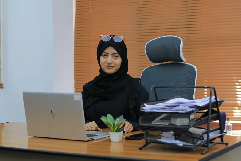 A Nahbal team member at her office desk