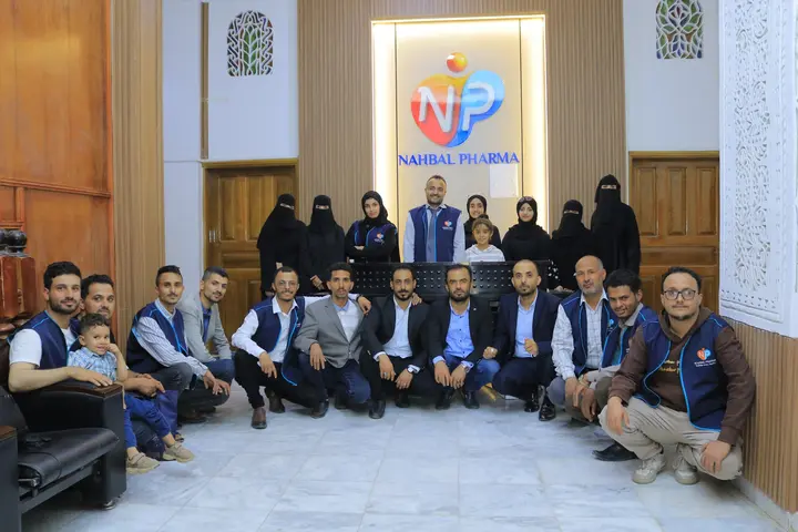 Nahbal Pharma team gathered inside the company office