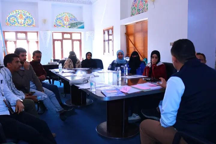 Nahbal Pharma team gathered around a table during an internal working session