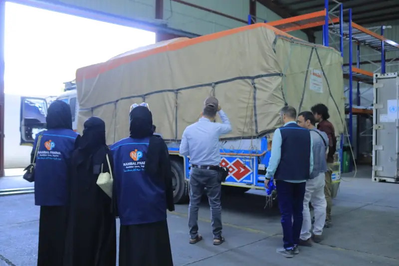 Nahbal team at the warehouse entrance as the shipment arrives