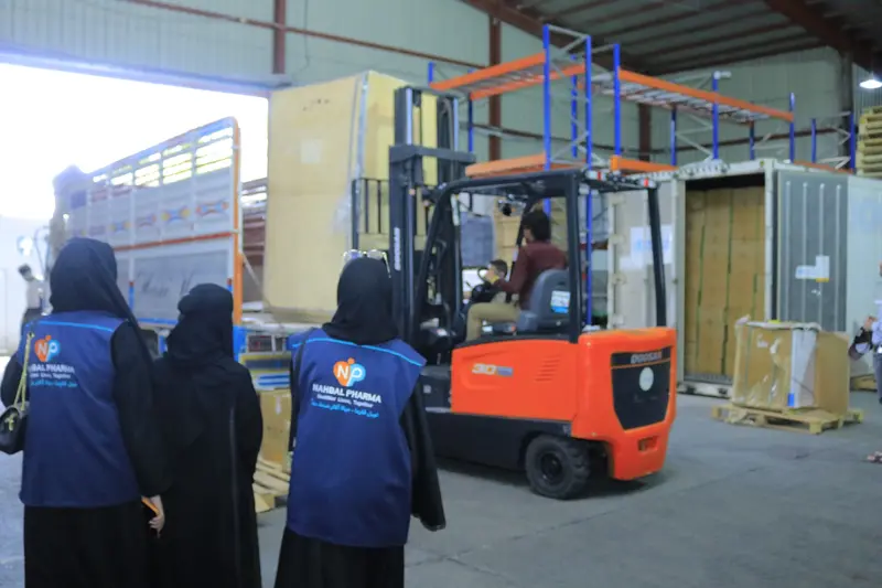 Nahbal team supervising forklift handling inside a warehouse