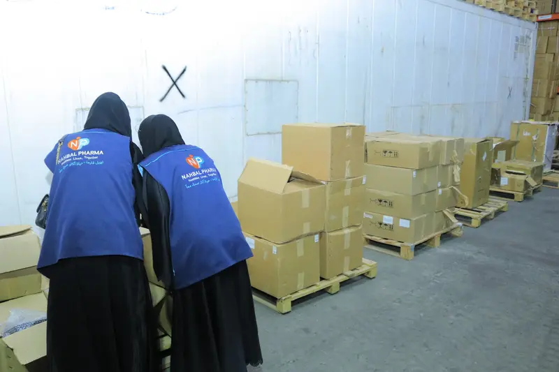 Nahbal team conducting a visual review of shipment cartons